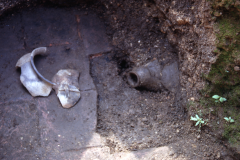 Remains of pot with crude embossed figure; Room II: photo A. Chatwin