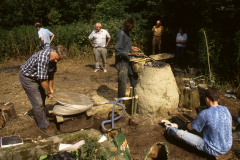 Time Team dig 1998; Dennis Beeney pumping the bellows: photo J. Hodgkinson