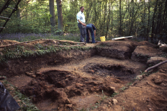 The smelting furnace before excavation with the consolidation hearth behind; Tony Weaver in the background: photo J. Hodgkinson