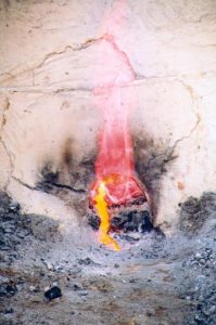 Molten slag flowing from the furnace during tapping